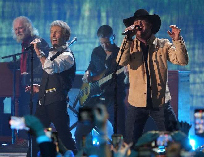 Paul Rodgers, left, and Cody Johnson perform at the CMT Awards at the Moody Center on Sunday, April 2, 2023, in Austin, Texas.